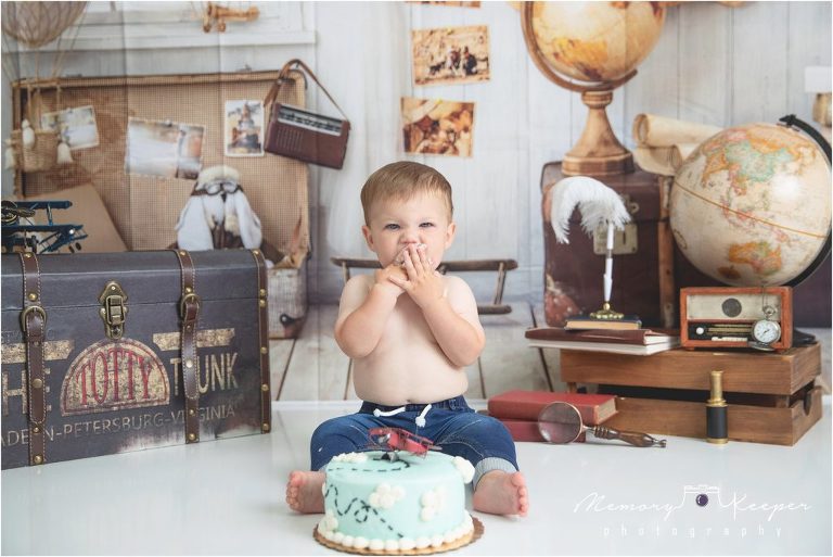 Boy enjoying cake with a theme of "Time Flies" 