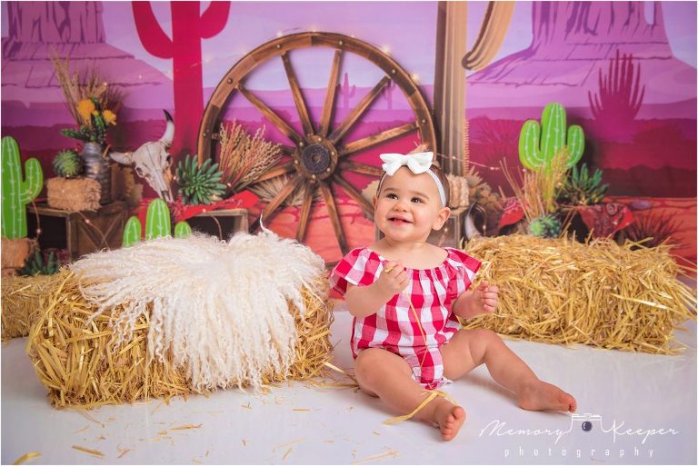 Baby girl first birthday photo with a western theme captured "wild one"